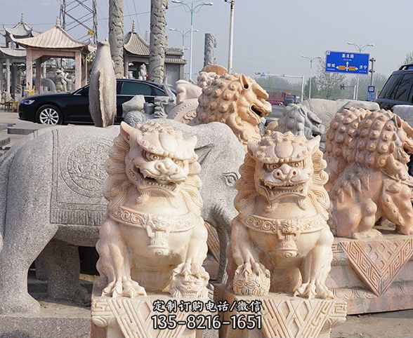 公园动物晚霞红狮子石雕图片